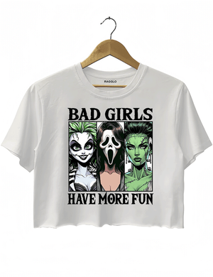 Ragglo white horror-themed cropped t-shirt with "Bad Girls Have More Fun" text and illustrations of three iconic horror characters, ideal for Halloween and horror movie fans.

