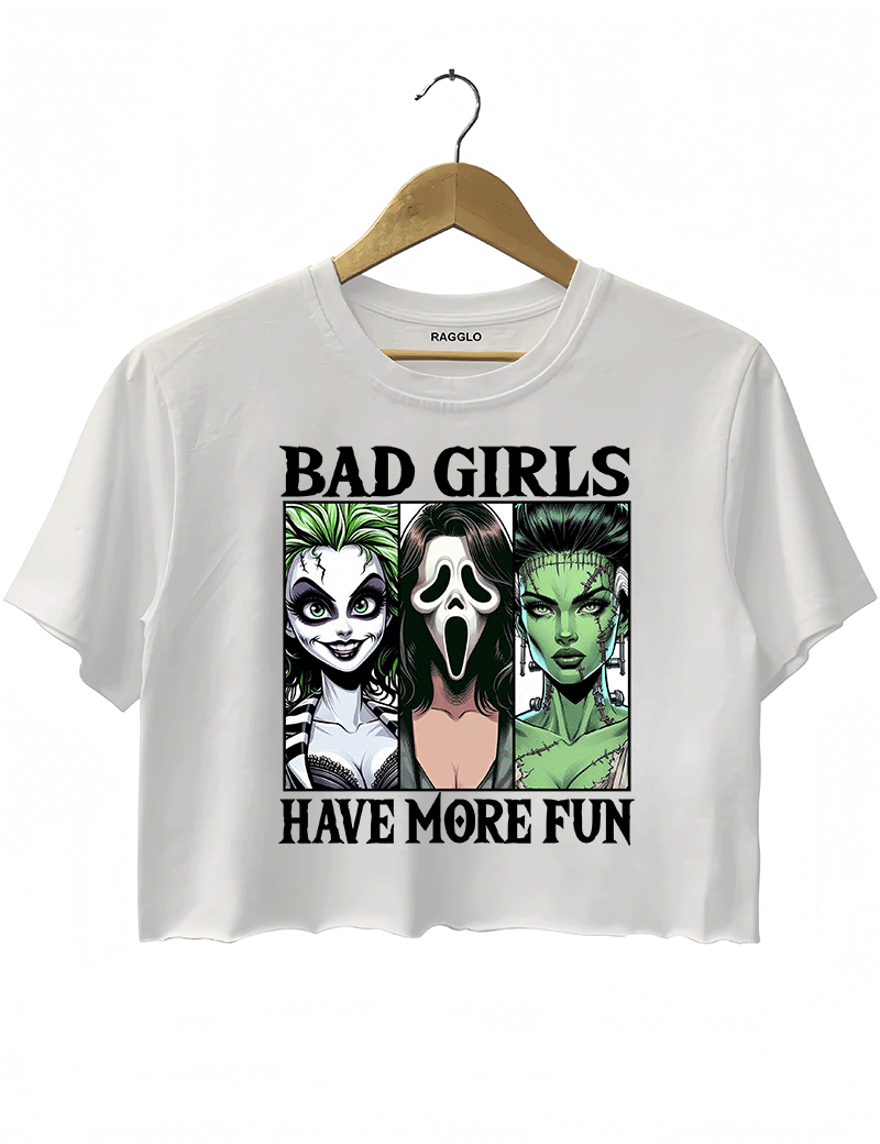 Ragglo white horror-themed cropped t-shirt with "Bad Girls Have More Fun" text and illustrations of three iconic horror characters, ideal for Halloween and horror movie fans.

