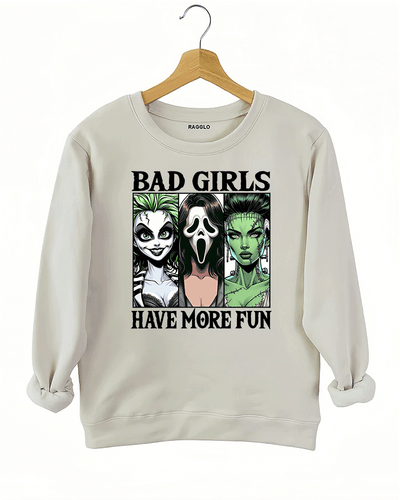 Ragglo beige sweatshirt with a striking graphic of Lydia Deetz from Beetlejuice, Ghostface from Scream, and Frankenstein's Bride, offering comfort and style for spooky season.