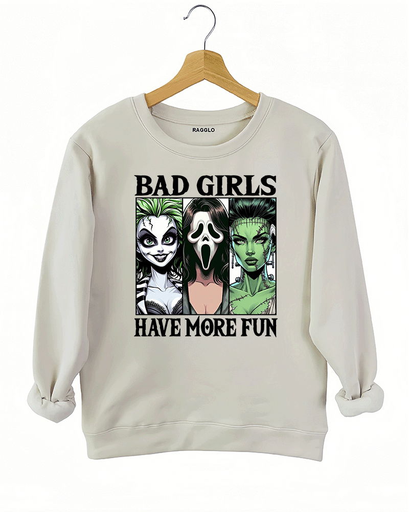 Ragglo beige sweatshirt with a striking graphic of Lydia Deetz from Beetlejuice, Ghostface from Scream, and Frankenstein's Bride, offering comfort and style for spooky season.