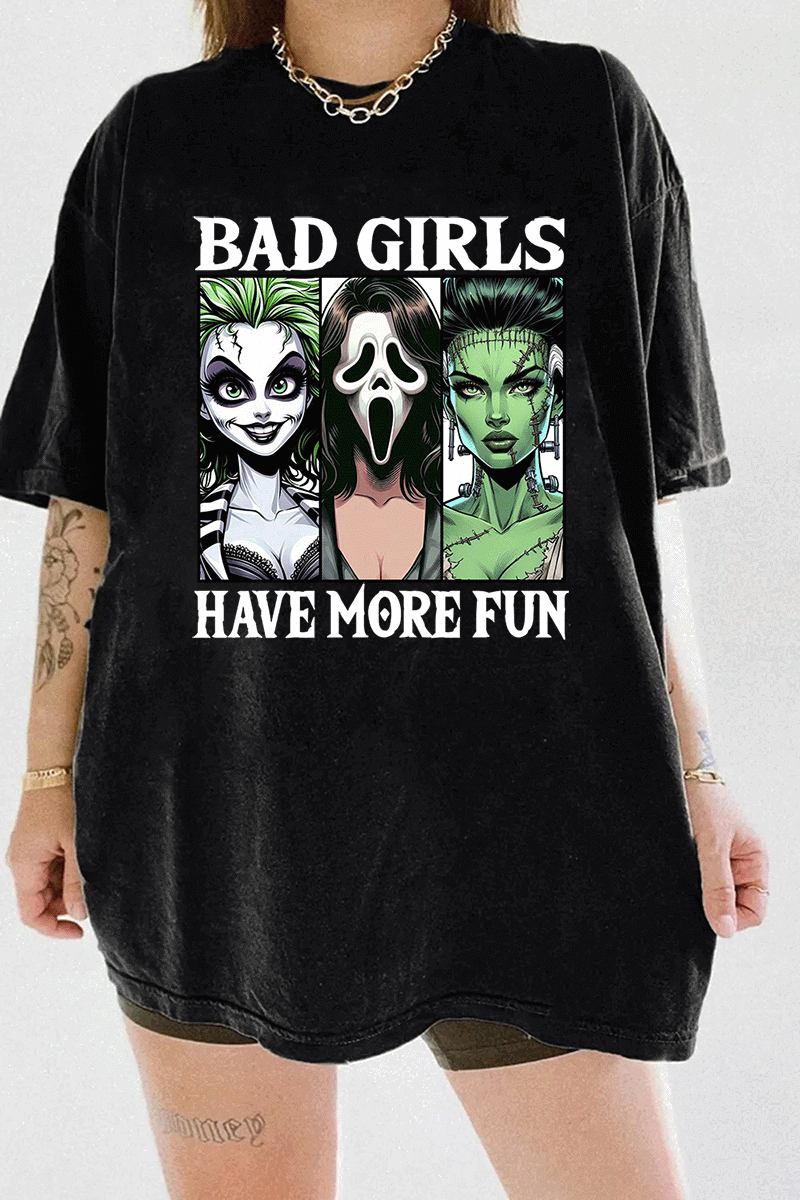 Ragglo black horror-themed t-shirt with "Bad Girls Have More Fun" text and illustrations of three iconic horror characters, ideal for Halloween and horror movie fans.

