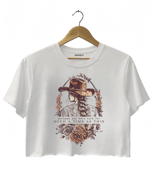 White Ragglo women's crop t-shirt with a cowgirl illustration, floral design, and inspirational text 'perhaps you were born for such a time as this' from Esther 4:14, perfect for empowering faith-based fashion.

