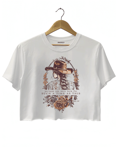 White Ragglo women's crop t-shirt with a cowgirl illustration, floral design, and inspirational text 'perhaps you were born for such a time as this' from Esther 4:14, perfect for empowering faith-based fashion.

