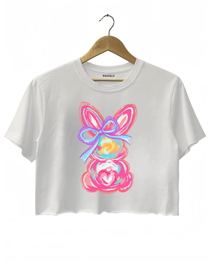 White Ragglo women's crop t-shirt featuring a cute bunny design with pink ears, blue bow, and heart accents, perfect for Easter or love-themed occasions.

