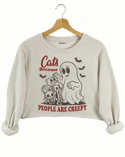 Ragglo beige crop sweatshirt featuring a ghost and three skeleton cats with bats and 'CATS BECAUSE PEOPLE ARE CREEPY' text, perfect for funny Halloween streetwear and cat lovers.

