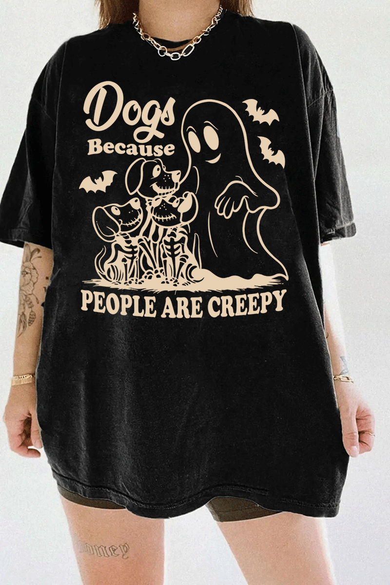 Ragglo black women's T-shirt featuring three skeleton dogs, a playful ghost, and bats with the humorous text 'Dogs Because People Are Creepy' in a spooky design.