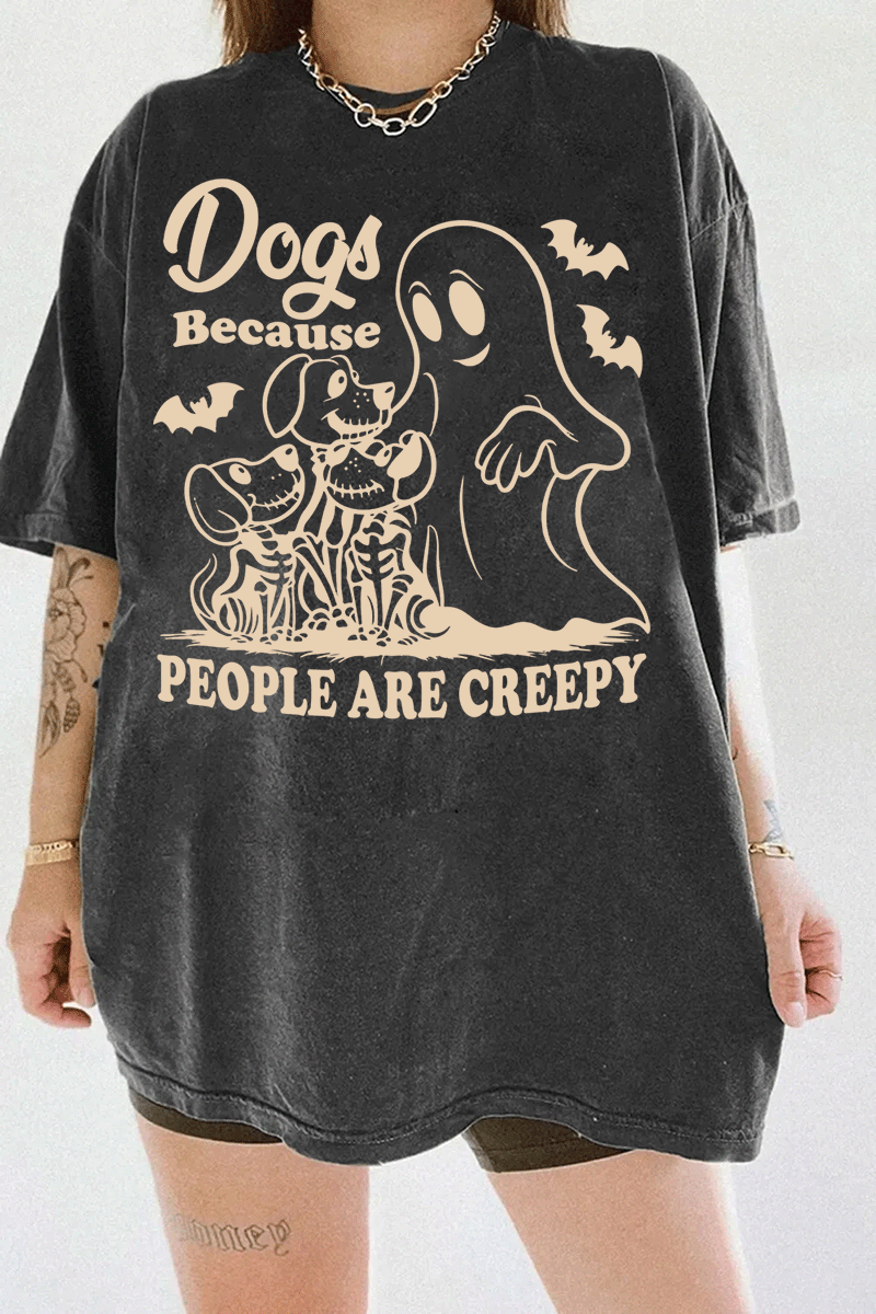 Ragglo dark gray women's T-shirt featuring three skeleton dogs, a playful ghost, and bats with the humorous text 'Dogs Because People Are Creepy' in a spooky design.
