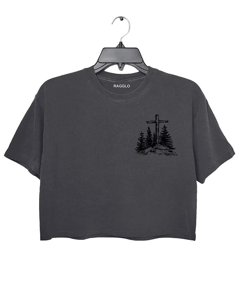 Ragglo dark gray women's crop top front featuring a minimalist design with a cross and trees in a faith-inspired style.