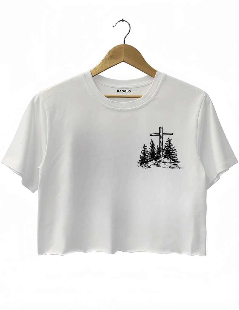 Ragglo white women's cropped T-Shirt front featuring a minimalist design with a cross and trees in a faith-inspired style.