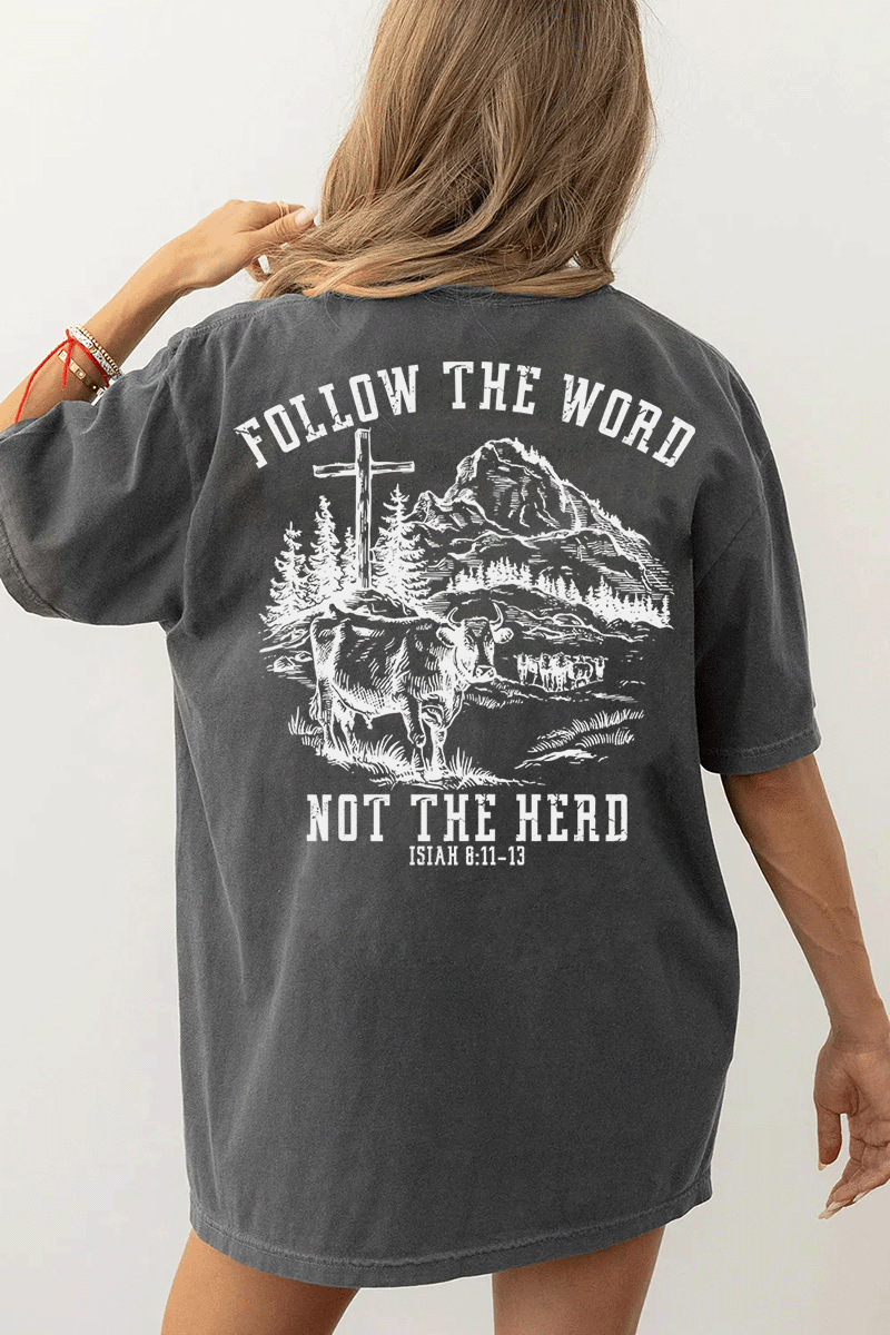 Ragglo dark gray women's T-Shirt back featuring a mountain landscape with cattle, a cross, and trees, and the text 'Follow The Word Not The Herd' and 'Isaiah 8:11-13' in a spiritual graphic design.