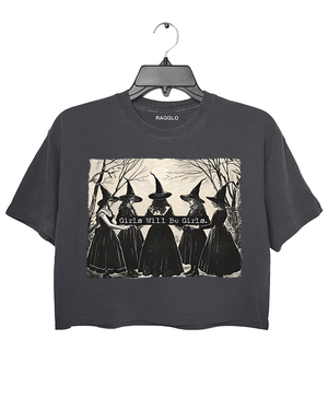 Ragglo dark gray women's crop top featuring five witches in black hats holding a sign with the text 'Girls Will Be Girls' in a spooky forest background.