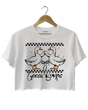A white cropped t-shirt from Ragglo featuring a "Goose Bumps" design with two geese in a playful pose, surrounded by a checkered pattern and stars.

