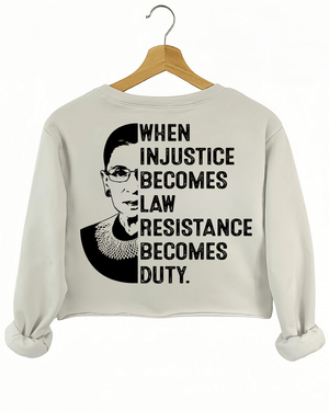 A beige sweatshirt from Ragglo with a silhouette of Ruth Bader Ginsburg and the text "WHEN INJUSTICE BECOMES LAW RESISTANCE BECOMES DUTY." on the back.


