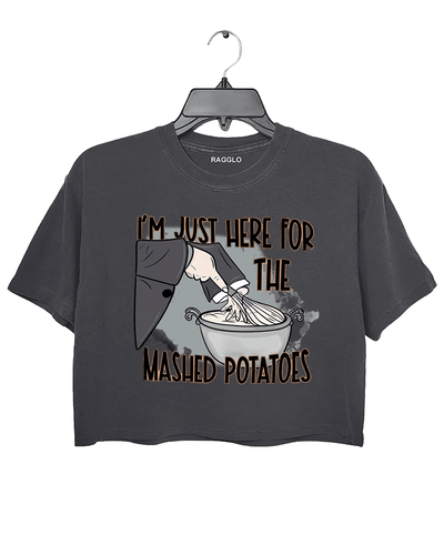 Funny dark gray cropped t-shirt with "I'm Just Here for the Mashed Potatoes" text and a hand mixing mashed potatoes graphic, perfect for Thanksgiving or food lovers.