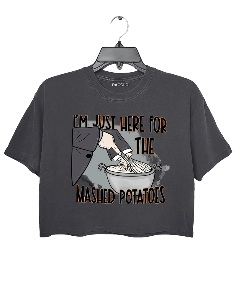Funny dark gray cropped t-shirt with "I'm Just Here for the Mashed Potatoes" text and a hand mixing mashed potatoes graphic, perfect for Thanksgiving or food lovers.
