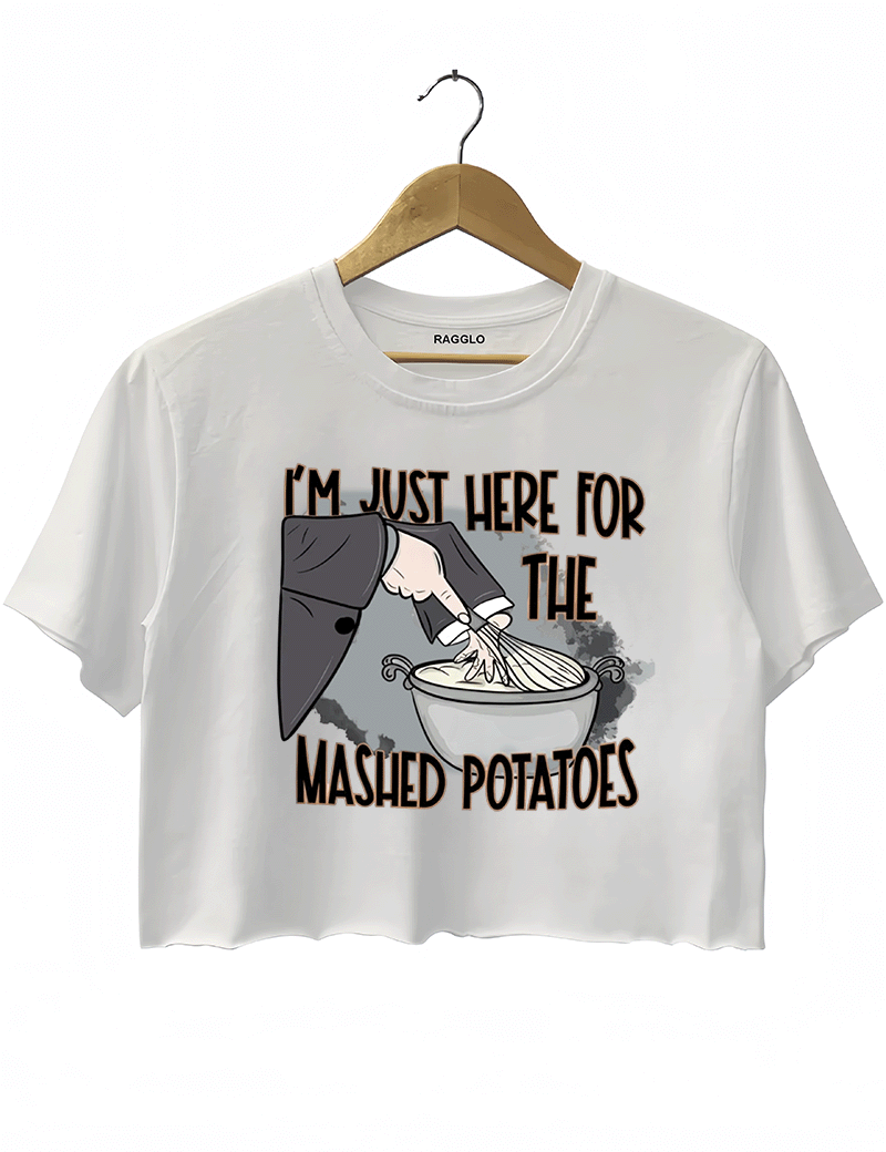 Funny white cropped t-shirt with "I'm Just Here for the Mashed Potatoes" text and a hand mixing mashed potatoes graphic, perfect for Thanksgiving or food lovers.

