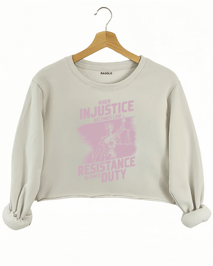 Ragglo beige crop sweatshirt with light pink 'When Injustice Becomes Law, Resistance Becomes Duty' slogan and Lady Justice design pattern