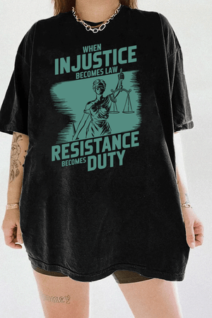 Ragglo black women's tee with ink green 'When Injustice Becomes Law, Resistance Becomes Duty' slogan and Lady Justice design pattern