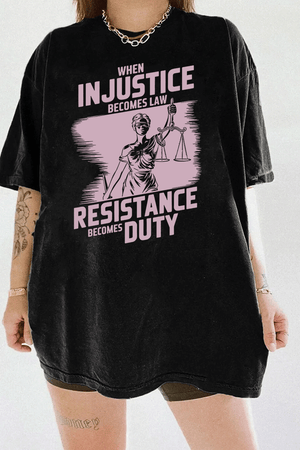 Ragglo black women's tee with light pink 'When Injustice Becomes Law, Resistance Becomes Duty' slogan and Lady Justice design pattern