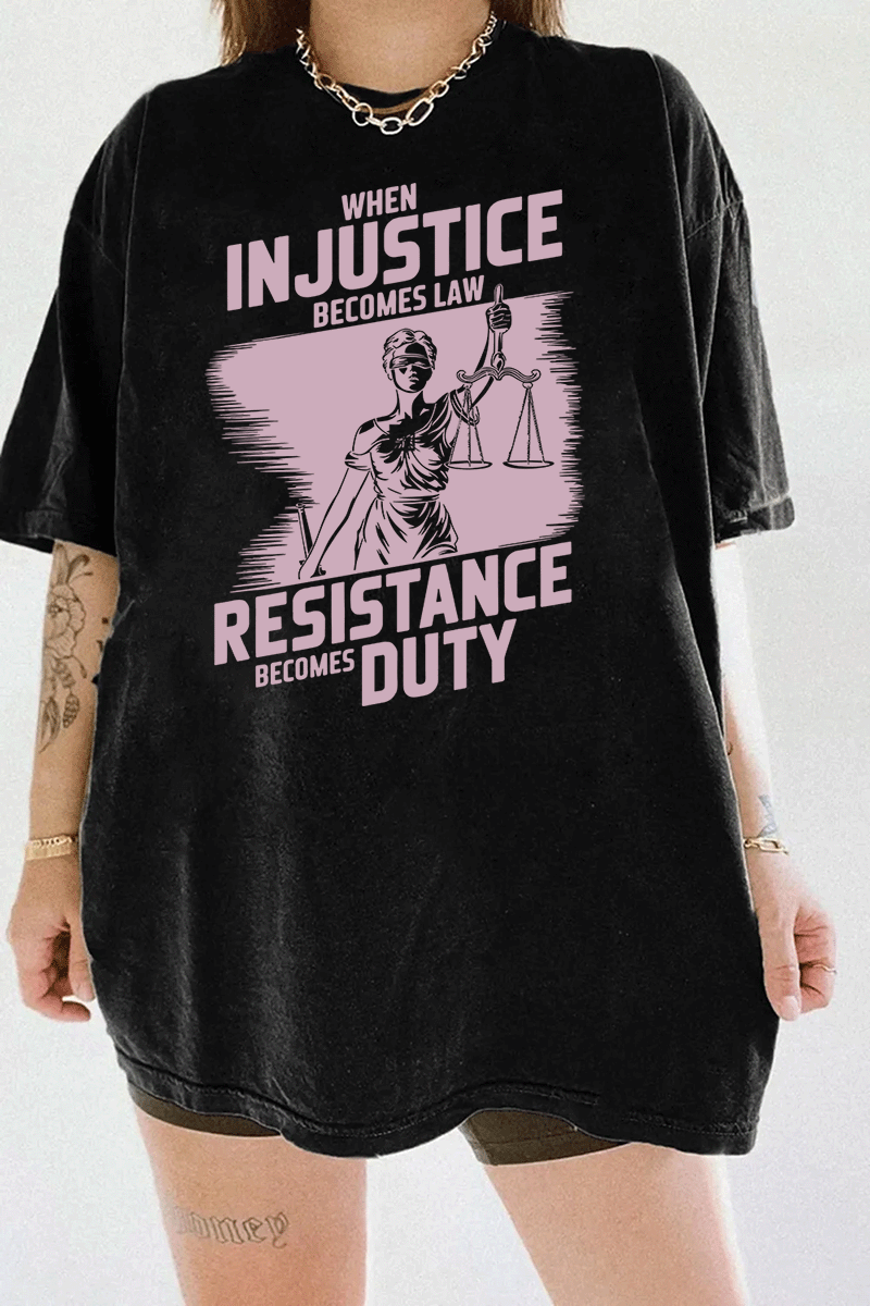 Ragglo black women's tee with light pink 'When Injustice Becomes Law, Resistance Becomes Duty' slogan and Lady Justice design pattern