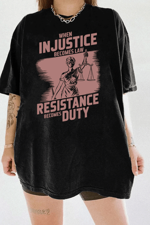 Ragglo black women's tee with rose brown 'When Injustice Becomes Law, Resistance Becomes Duty' slogan and Lady Justice design pattern