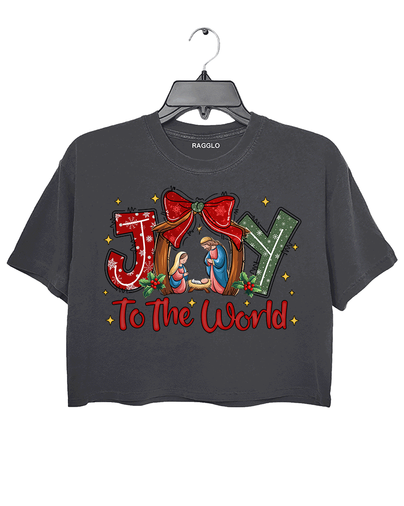 Ragglo dark gray crop top featuring 'JOY TO THE WORLD' text with a nativity scene, a red bow, and holly leaves, perfect for religious Christmas streetwear and festive celebrations.





