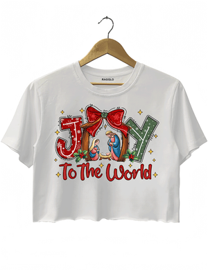 Ragglo white crop top featuring 'JOY TO THE WORLD' text with a nativity scene, a red bow, and holly leaves, perfect for religious Christmas streetwear and festive celebrations.



