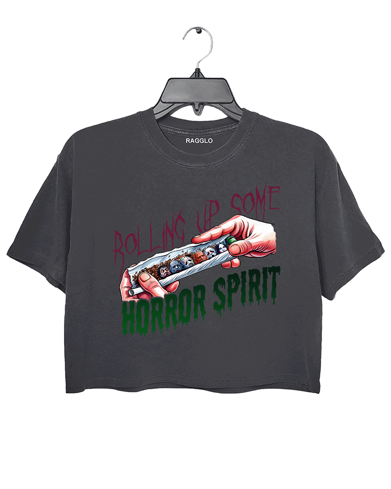 Ragglo dark gray crop top featuring a hand rolling a cigarette with horror movie characters' faces, with 'ROLLING UP SOME HORROR SPIRIT' text, perfect for Halloween streetwear for horror movie fans.

