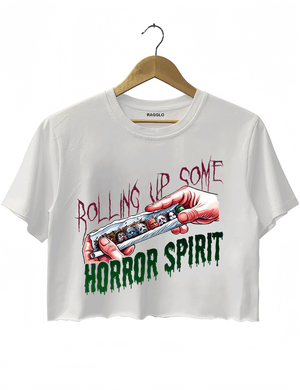 Ragglo white crop top featuring a hand rolling a cigarette with horror movie characters' faces, with 'ROLLING UP SOME HORROR SPIRIT' text, perfect for Halloween streetwear for horror movie fans.

