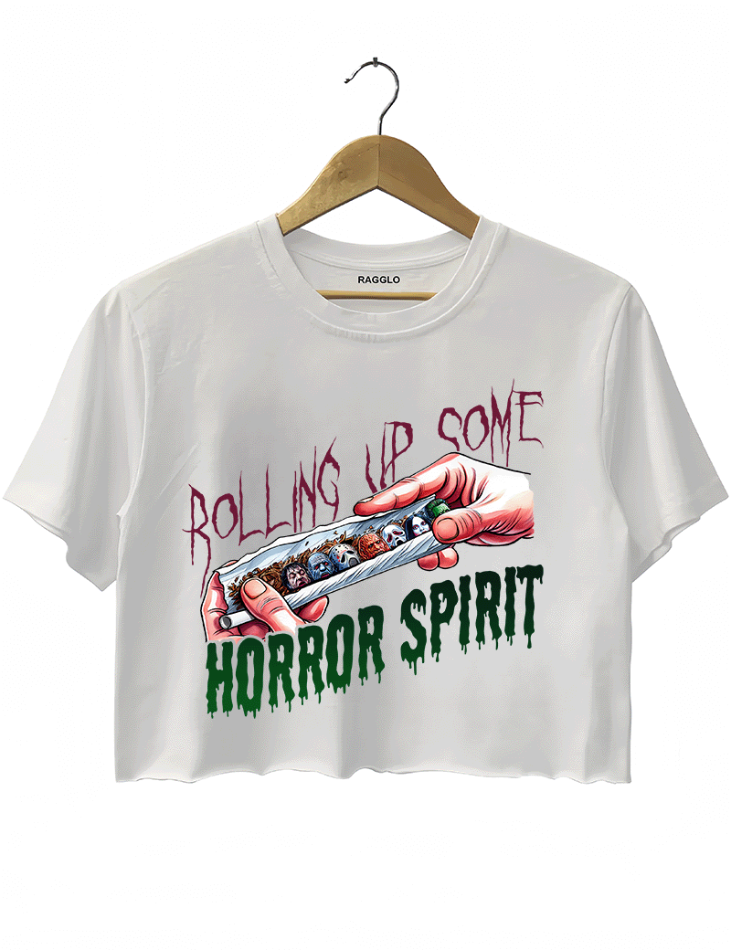 Ragglo white crop top featuring a hand rolling a cigarette with horror movie characters' faces, with 'ROLLING UP SOME HORROR SPIRIT' text, perfect for Halloween streetwear for horror movie fans.


