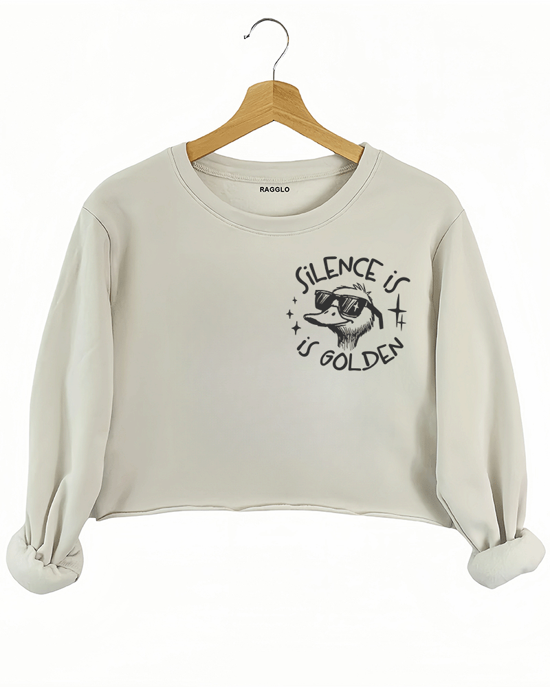 Ragglo beige women's crop sweatshirt front featuring a cool duck with sunglasses and the text 'Silence is Golden' in a humorous graphic design