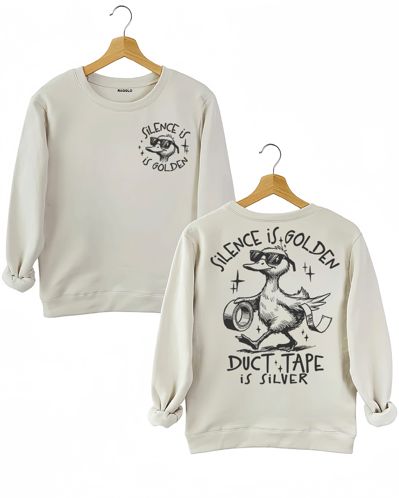 Ragglo beige women's sweatshirt featuring a cool duck with sunglasses on both front and back, with 'Silence is Golden' on the front and 'Duct Tape is Silver' with a duck holding duct tape on the back, in a humorous graphic design
