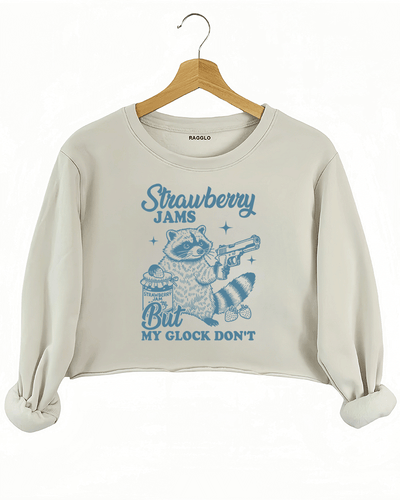 Ragglo women's beige crop sweatshirt with cute blue 'Strawberry Jams But MY GLOCK DON'T' raccoon graphic

