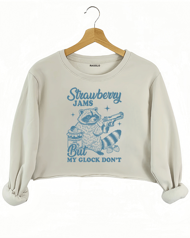 Ragglo women's beige crop sweatshirt with cute blue 'Strawberry Jams But MY GLOCK DON'T' raccoon graphic

