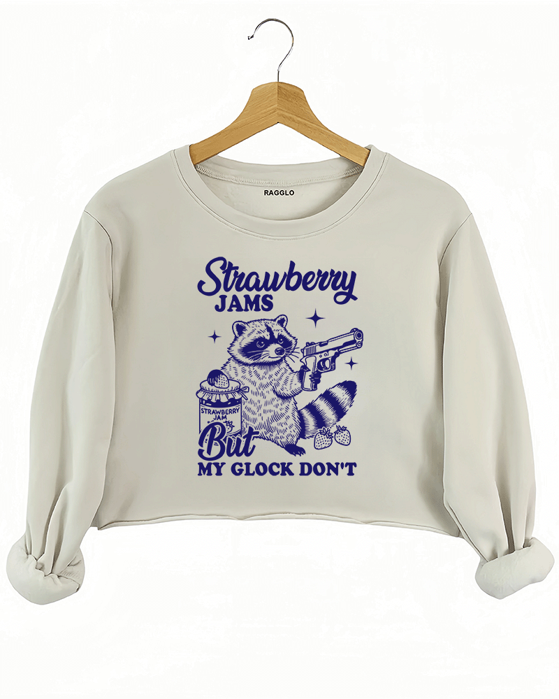 Ragglo women's beige crop sweatshirt with cute dark blue 'Strawberry Jams But MY GLOCK DON'T' raccoon graphic

