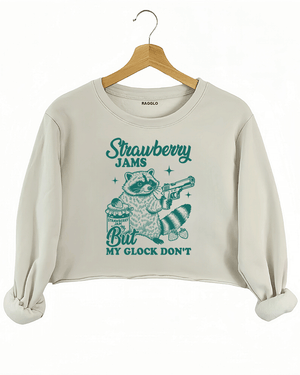 Ragglo women's beige crop sweatshirt with cute green 'Strawberry Jams But MY GLOCK DON'T' raccoon graphic


