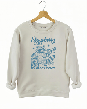 Ragglo women's beige sweatshirt with funny blue 'Strawberry Jams But MY GLOCK DON'T' raccoon graphic

