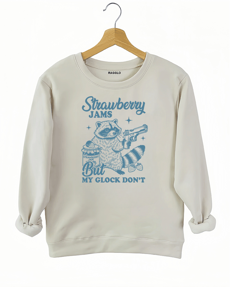 Ragglo women's beige sweatshirt with funny blue 'Strawberry Jams But MY GLOCK DON'T' raccoon graphic

