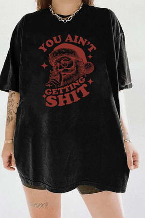 Black Ragglo women's t - shirt with a funny Santa Claus graphic and the text "YOU AIN'T GETTING SHIT" in red, perfect for the holiday season, hanging on a wooden hanger.

