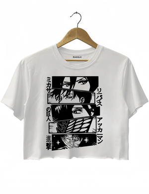 Ragglo white crop top featuring black-and-white manga-style portraits of four characters with Japanese text '進撃の巨人', perfect for anime fans and Attack on Titan streetwear.

