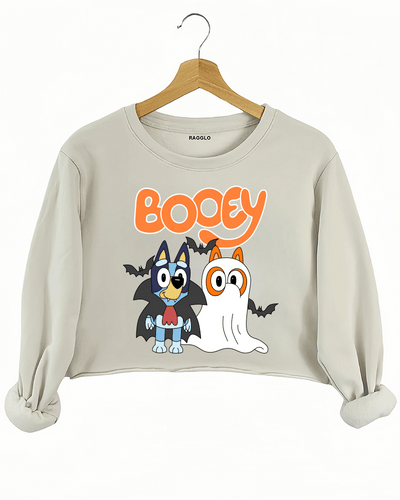 Ragglo beige crop sweatshirt featuring two Bluey characters in vampire and ghost costumes with bats, with 'BOOEY' text, perfect for cute Halloween streetwear for animation fans.

