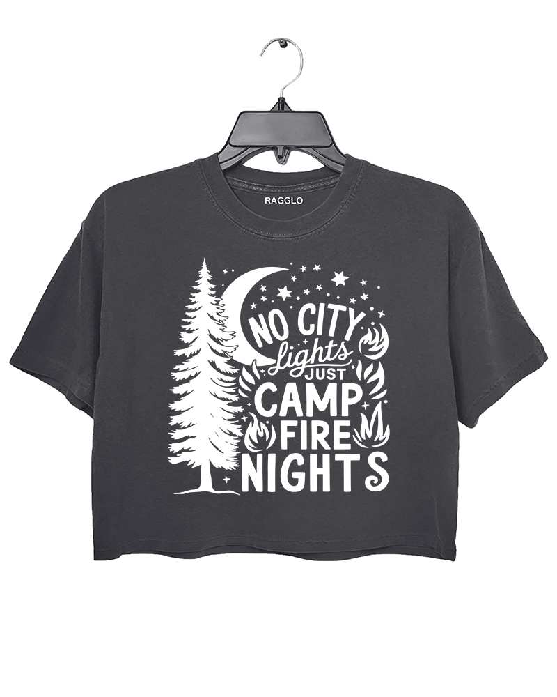 Ragglo dark gray crop top featuring a pine tree, moon, stars, and campfire elements, with 'NO CITY LIGHTS JUST CAMP FIRE NIGHTS' text, perfect for outdoor camping streetwear for nature lovers.

