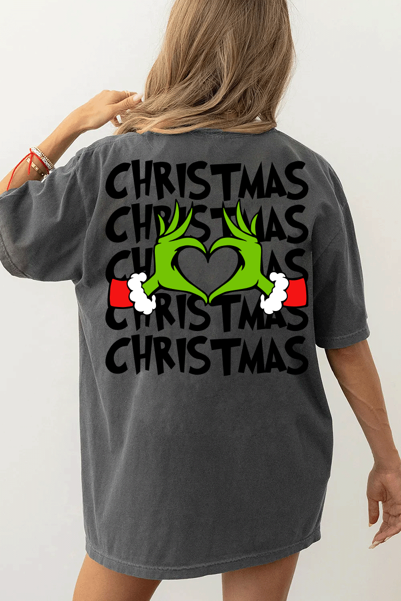 Ragglo dark gray women's T-Shirt back featuring larger Grinch hands making a heart shape with Santa cuffs, surrounded by the repeated text 'Christmas' in a humorous holiday graphic design.