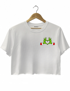 Ragglo white women's crop top front featuring Grinch hands making a heart shape with Santa cuffs in a playful Christmas design.