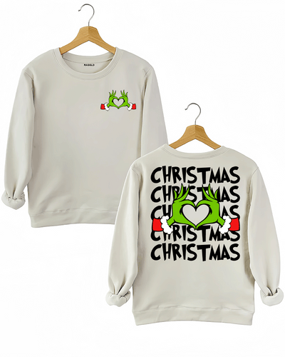 Ragglo beige women's sweatshirt featuring Grinch hands making a heart shape with Santa cuffs on the front, and larger Grinch hands with 'Christmas' text repeated around them on the back, in a funny holiday graphic design.