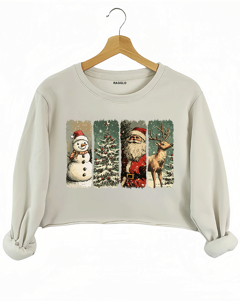 Ragglo beige crop sweatshirt featuring a snowman with a Santa hat, Santa Claus, and a reindeer with a snowy Christmas tree background, perfect for festive streetwear and holiday celebrations.

