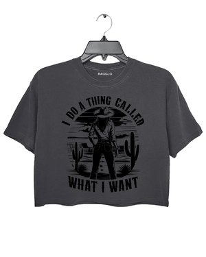 Ragglo dark gray crop top featuring a cowgirl in a desert with cacti and a sunset, with 'I DO A THING CALLED WHAT I WANT' text, perfect for western-inspired streetwear for free spirits.

