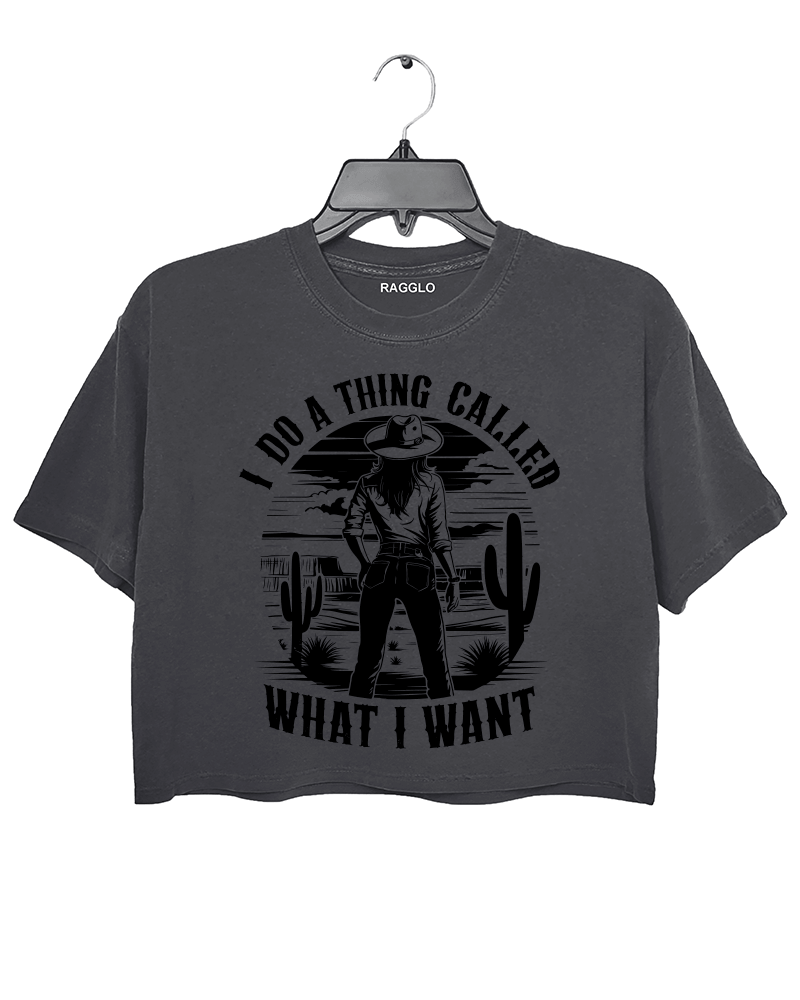 Ragglo dark gray crop top featuring a cowgirl in a desert with cacti and a sunset, with 'I DO A THING CALLED WHAT I WANT' text, perfect for western-inspired streetwear for free spirits.

