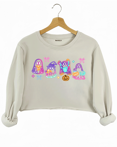 Ragglo beige crop sweatshirt featuring four cute neon ghosts with pumpkins and pizza, accented by bows and stars, perfect for festive Halloween streetwear and fun celebrations.

