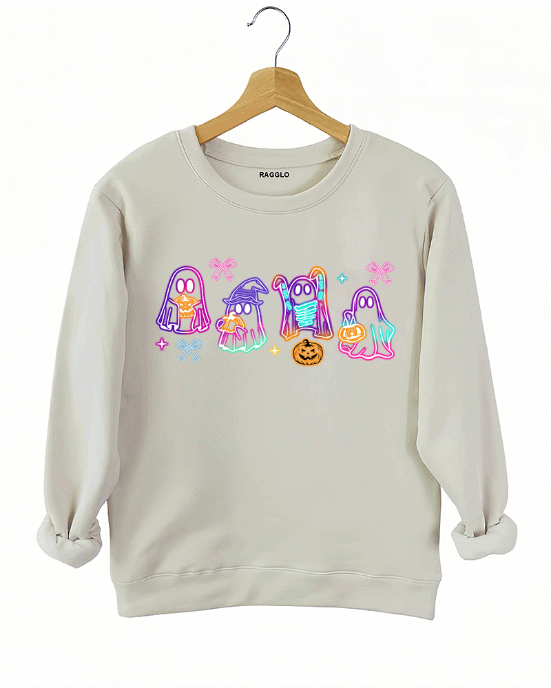 Ragglo beige sweatshirt featuring four cute neon ghosts with pumpkins and pizza, accented by bows and stars, perfect for festive Halloween streetwear and fun celebrations.


